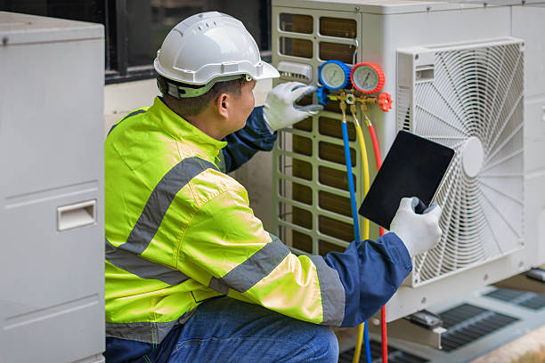 Professional Heat Pump Repair technician working in Moreland, GA